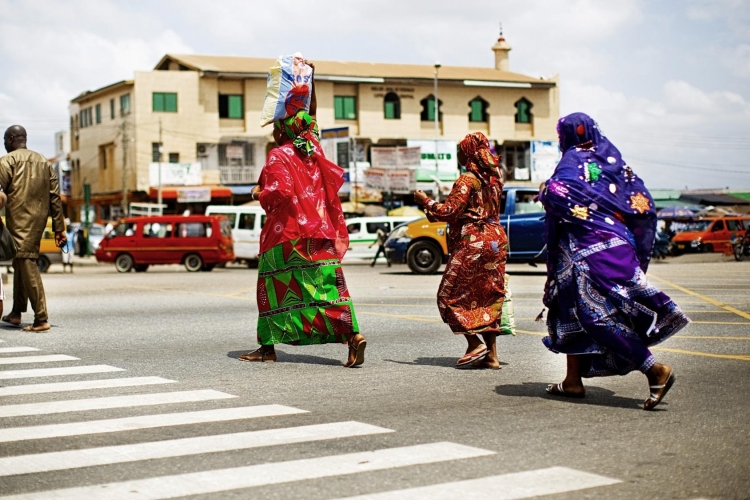 compressed_women_crossing_busy_road_in_accra